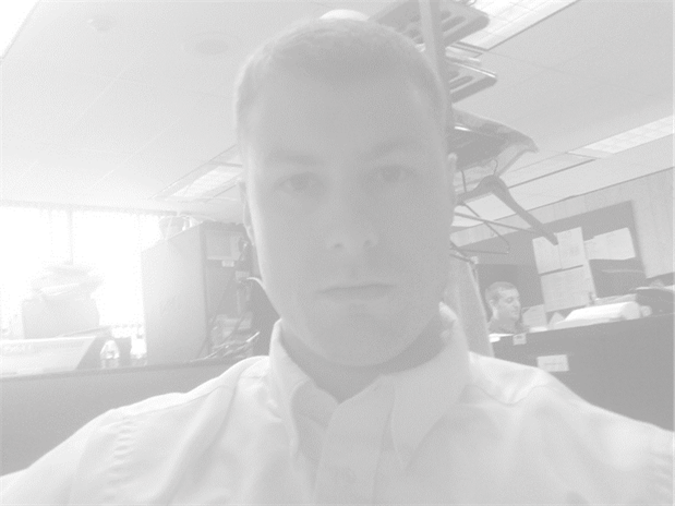 A person smiling for the camera

Description automatically generated